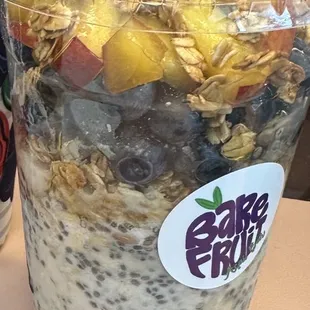 Vanilla overnight oats with granola blueberries and peaches