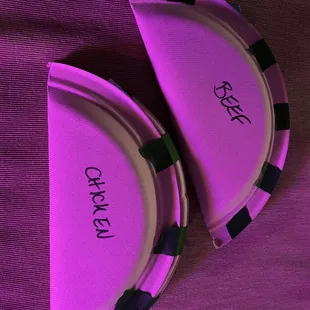 Paper plate empanadas to hold my to-go empanadas, and they even labeled them!