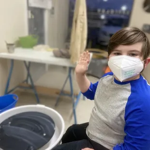 Happy kid at throwing wheel