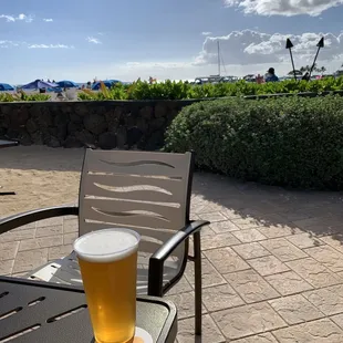 a pint of beer on a patio table