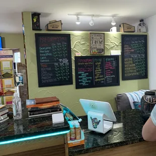 a man sitting at a counter with a laptop