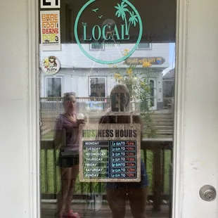 Front door with menu hours