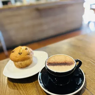 a cup of coffee and a muffin