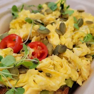 scrambled eggs with tomatoes and sprouts