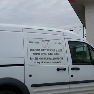 a van parked in front of a building