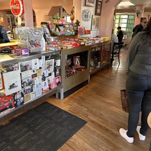 a woman standing in front of the counter