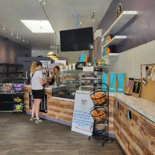 two people standing at a counter