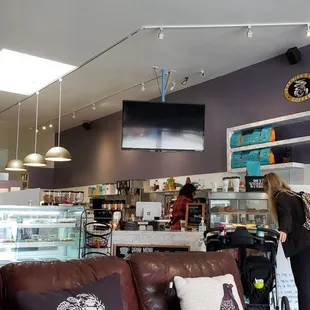two women standing in a coffee shop