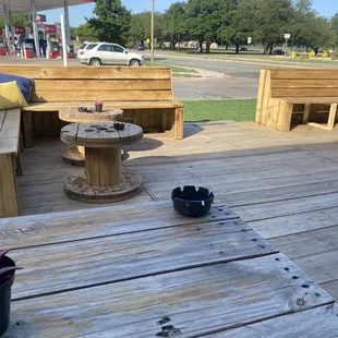 a table and benches on a wooden deck