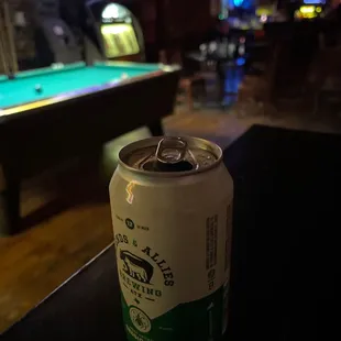a can of beer on a table