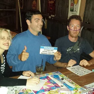 a group of people sitting at a table