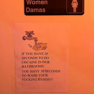 a women's bathroom sign