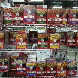 a shelf full of boxes of helper popcorn