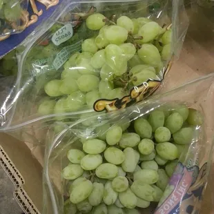 a bunch of grapes in plastic bags