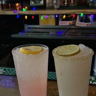 two cocktails on a bar