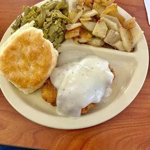 Chicken fried chicken special. With green beans, German potatoes and biscuit