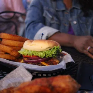 a burger and onion rings