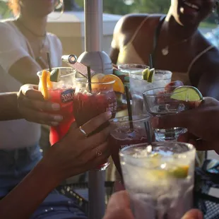 a group of people toasting drinks