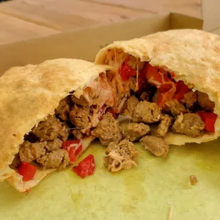 Panzerotti fritti Rustico (italian sausage, red bell peppers, Asiago cheese, mozzarella cheese and tomatoes, )