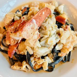 Delicious squid ink pasta with lobster and shrimp