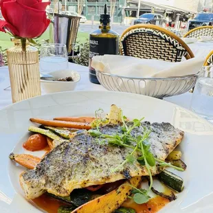 a plate of fish and vegetables