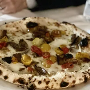 a pizza on a white plate