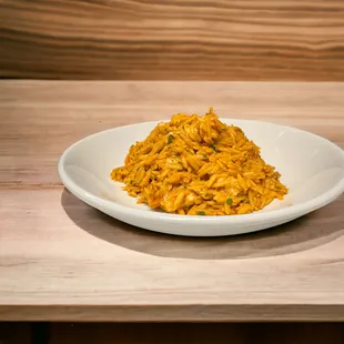 Orzo pasta with slow roasted tomatoes, garlic, &amp; crab meat.