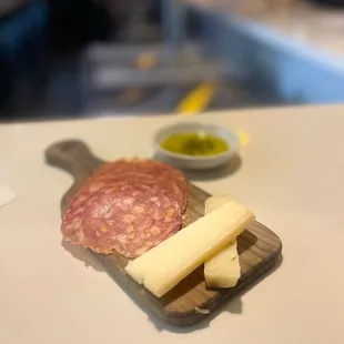 a plate of meat and cheese