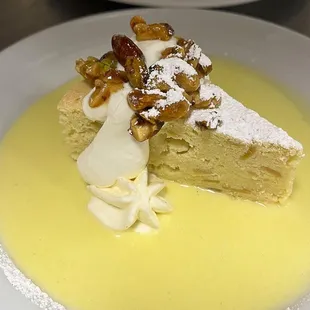 Almond ricotta cake with  almond custard, sweetened crema, &amp; nuts