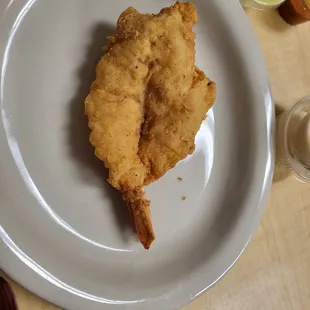 a plate of fried fish