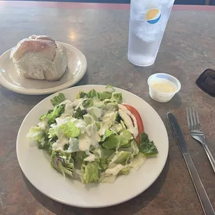 Lunch salad with roll.