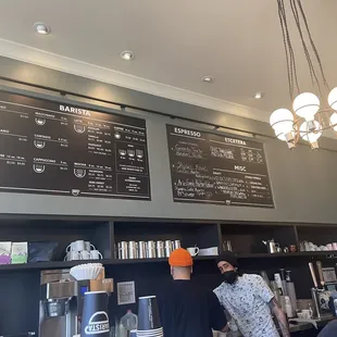 menus on the wall of a coffee shop
