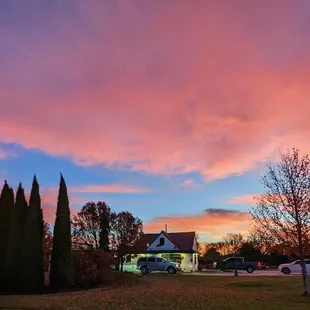 a sunset in a residential neighborhood