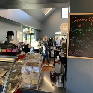 a woman standing in a bakery