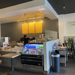a coffee shop with a display of drinks