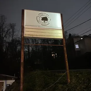 a sign with a clock on it