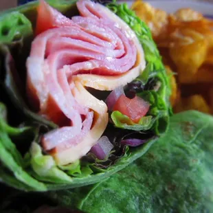 a wrap of ham and lettuce