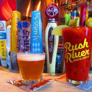 a glass of beer and a drink