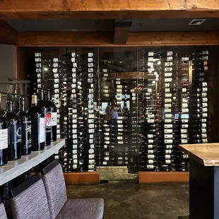 a wine cellar with wine bottles