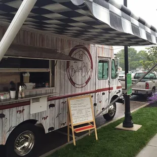 a food truck parked on the side of the road