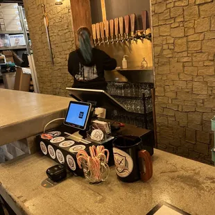 a bar counter with a laptop on it