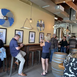 a group of people at a bar