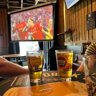 Sports on the projector. Beer in the glass!