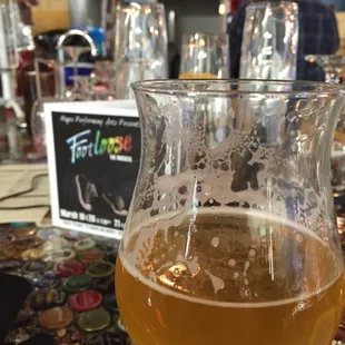 a glass of beer on a table