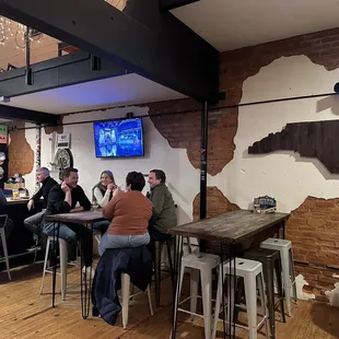 a group of people sitting at a bar