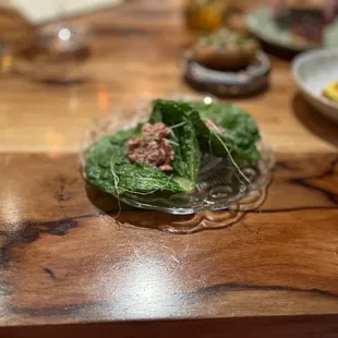 a plate of food on a wooden table