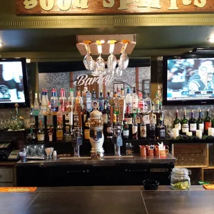 a bar with liquor bottles on the counter