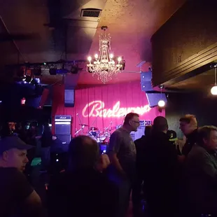 a crowd of people at a bar