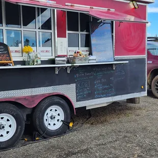 a food truck parked in a parking lot
