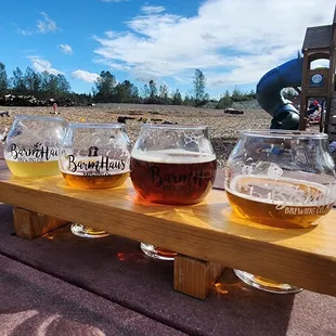 a row of beer glasses on a table